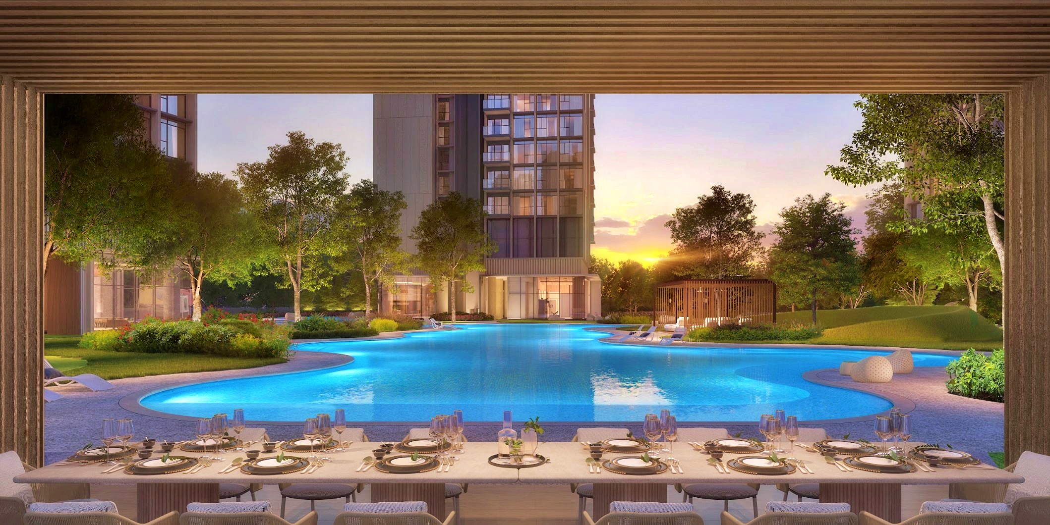 Digital rendering of a dining table with place settings, framed by a wooden structure, overlooking a lagoon-style pool and multi-story building at sunset.