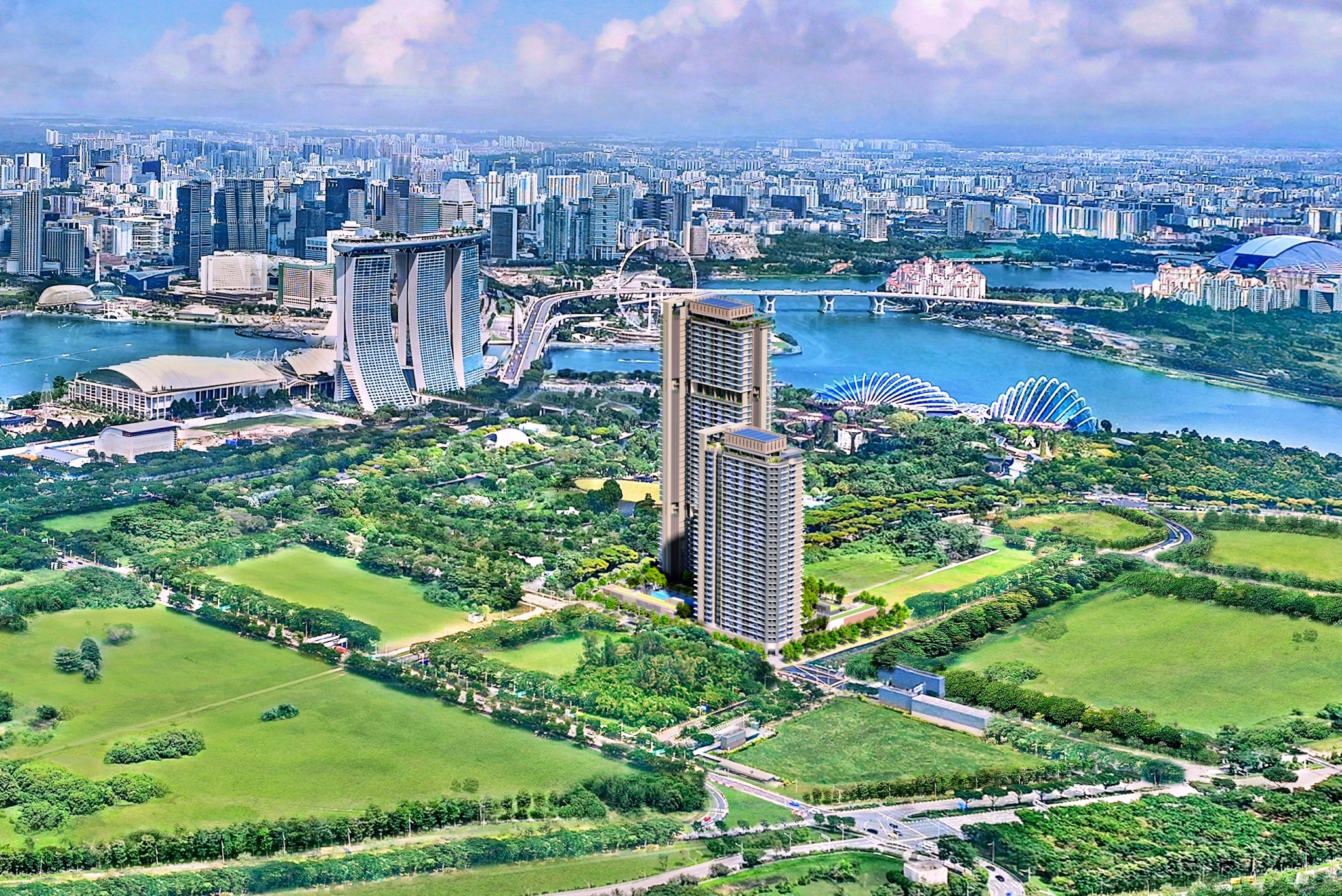 Aerial view of One Marina Gardens, a luxury waterfront condominium situated amidst greenery, with Marina Bay Sands, the Central Business District, and Singapore’s skyline in the background.