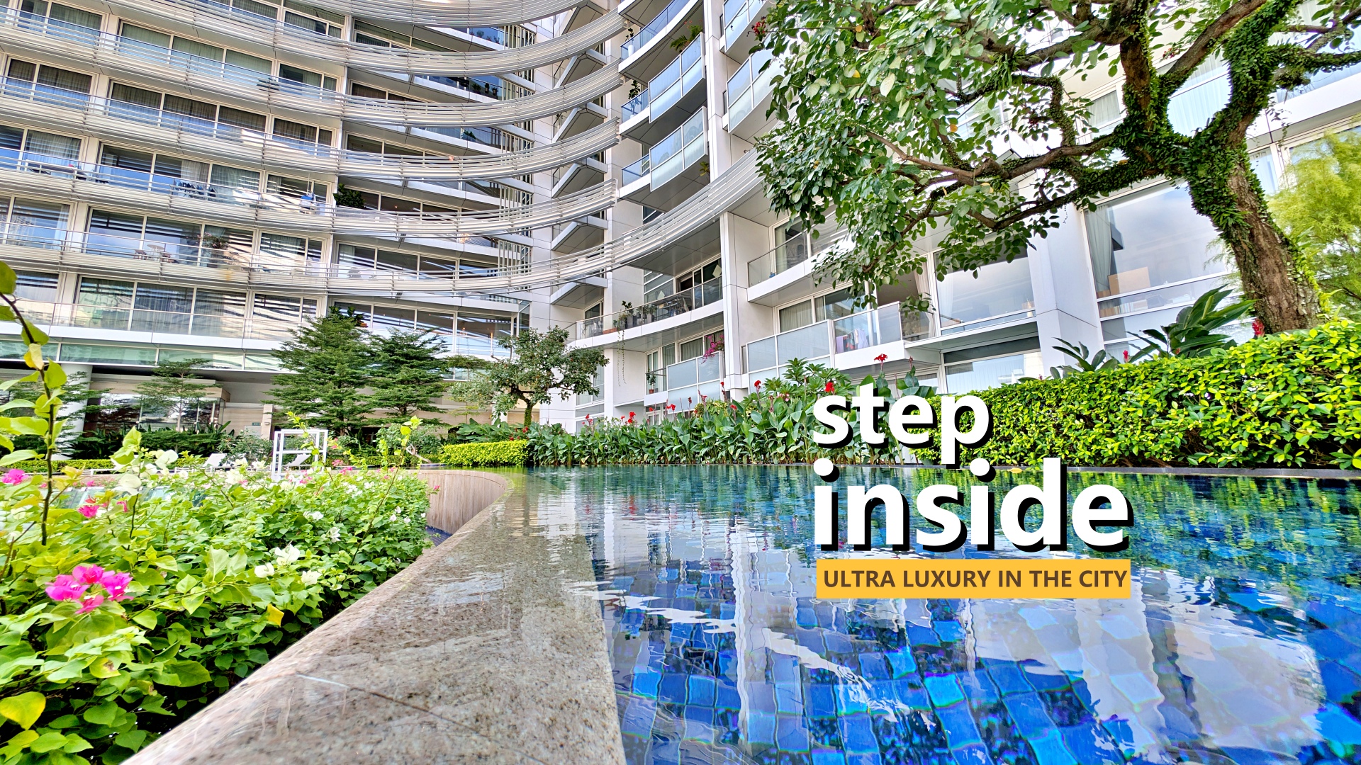 A low-angle shot of a modern, multi-story residential building with curved balconies, reflected in a shimmering blue pool. Lush green plants and trees surround the pool. The words "step inside" are in large white text on the right, with "ULTRA LUXURY IN THE CITY" on a smaller yellow bar below.